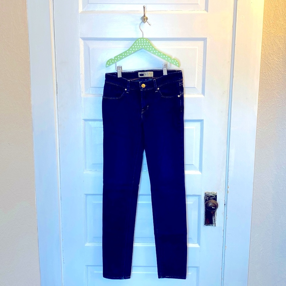 The jeans have been worn a few times and have a small imperfection on the back.